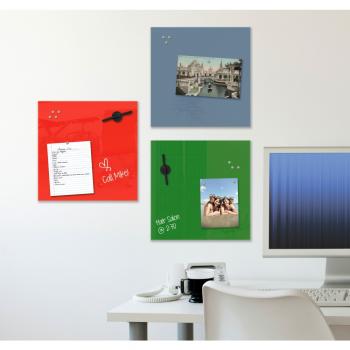 Colored magnetic glass whiteboards are displayed on a wall.