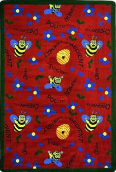 A rectangle shaped red childrens rug with bees for the classroom.