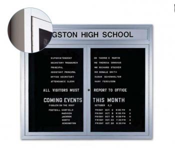 An aluminum framed business message board with two locking tempered glass doors.