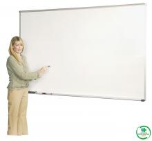 A woman stands in front of the magnetic porcelain steel dry erase classroom white board.