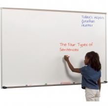 A laminate dry erase whiteboard is shown being drawn on by a child. It features an aluminum tray with rubber caps for safety and a full length accessory tray.