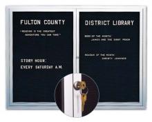 This metal framed message board has continuous close piano hinges that keep the doors closed and locked.